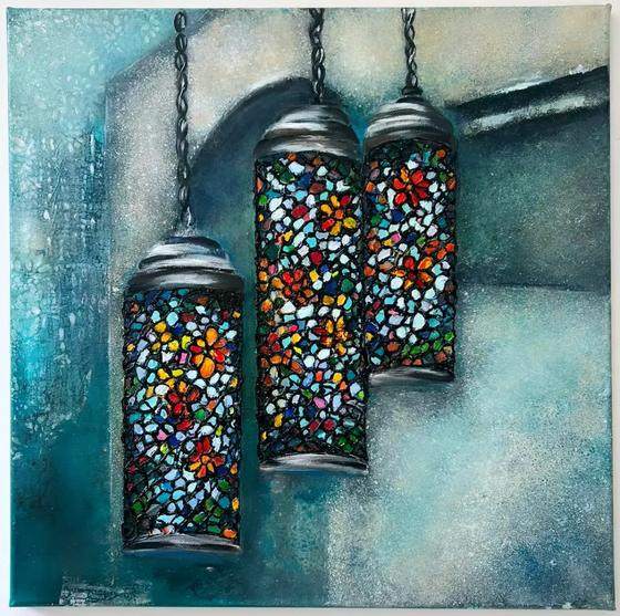 Lantern of Morocco by Sofina: cluster of Moroccan mosaic glass lanterns glowing in bright colours against deep blue